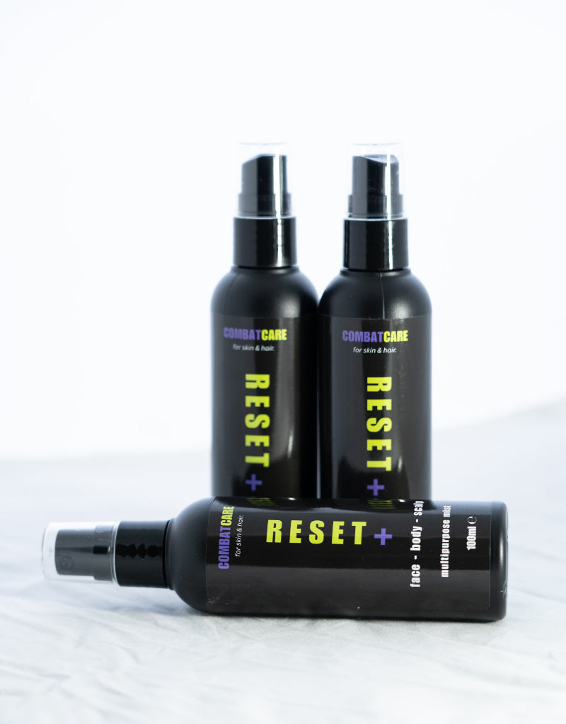 Three black bottles labeled 'Reset' on a white background
